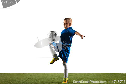 Image of Young boy as a soccer or football player on white studio background