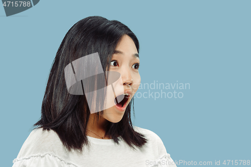 Image of Korean young woman\'s half-length portrait on blue background