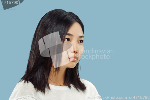 Image of Korean young woman\'s half-length portrait on blue background