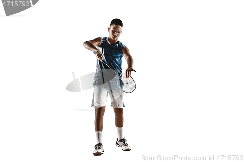 Image of Little boy playing badminton isolated on white studio background