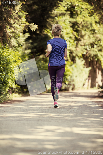 Image of young female runner training for marathon