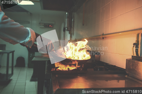 Image of Chef doing flambe on food