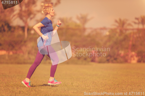 Image of young female runner training for marathon