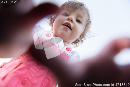 Image of little girl spending time at backyard