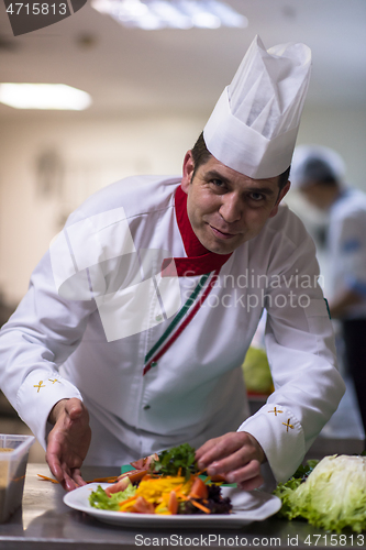 Image of chef serving vegetable salad