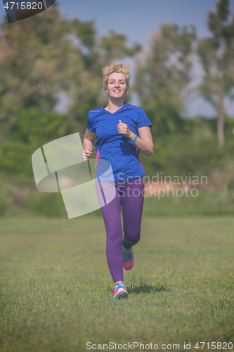 Image of young female runner training for marathon