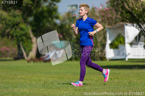 Image of young female runner training for marathon