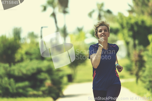 Image of young female runner training for marathon