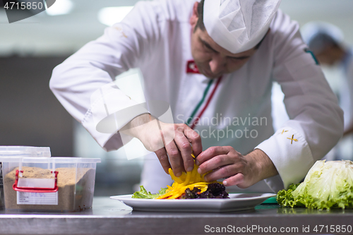 Image of chef serving vegetable salad