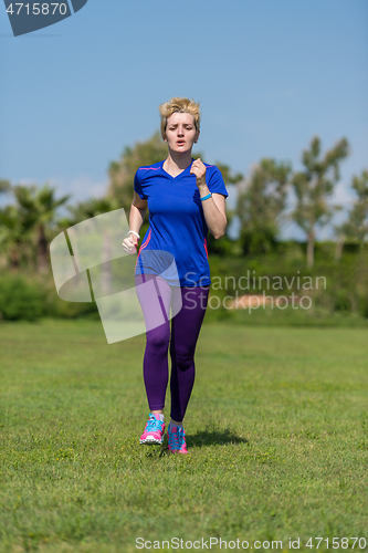 Image of young female runner training for marathon