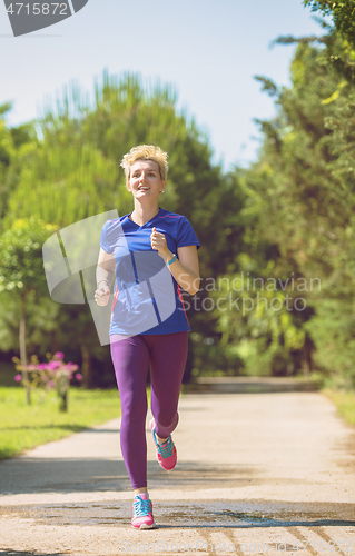 Image of young female runner training for marathon