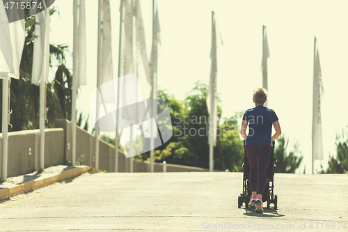 Image of mom with baby stroller jogging