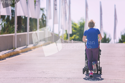 Image of mom with baby stroller jogging