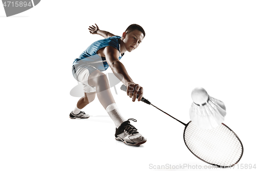 Image of Little boy playing badminton isolated on white studio background