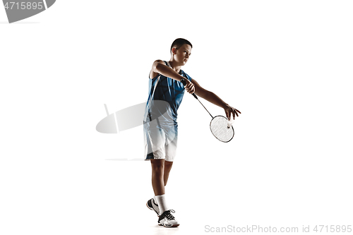 Image of Little boy playing badminton isolated on white studio background