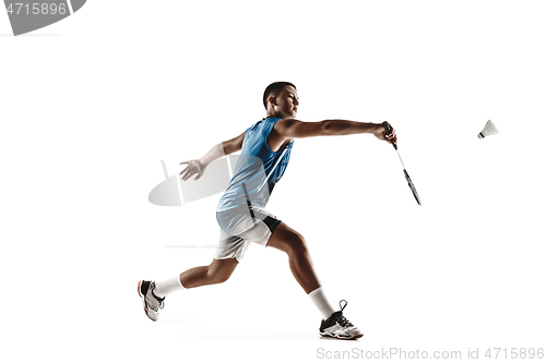 Image of Little boy playing badminton isolated on white studio background