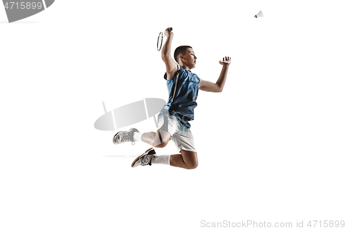 Image of Little boy playing badminton isolated on white studio background