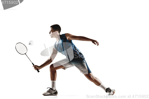 Image of Little boy playing badminton isolated on white studio background