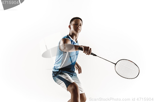 Image of Little boy playing badminton isolated on white studio background