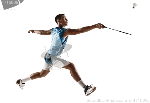 Image of Little boy playing badminton isolated on white studio background