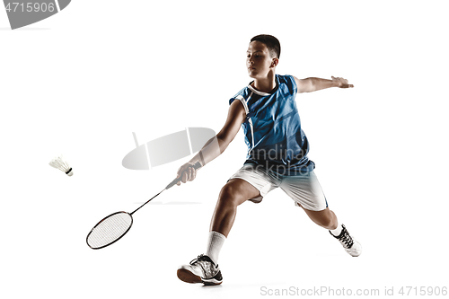 Image of Little boy playing badminton isolated on white studio background