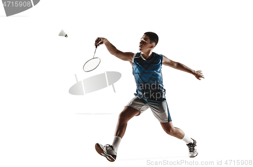 Image of Little boy playing badminton isolated on white studio background