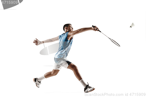 Image of Little boy playing badminton isolated on white studio background