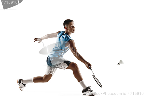 Image of Little boy playing badminton isolated on white studio background