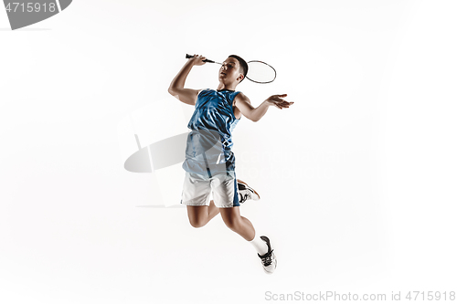 Image of Little boy playing badminton isolated on white studio background