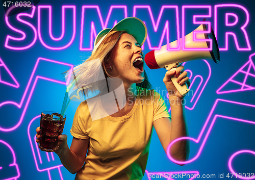 Image of Beautiful girl isolated on studio background in neon light