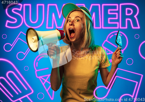 Image of Beautiful girl isolated on studio background in neon light