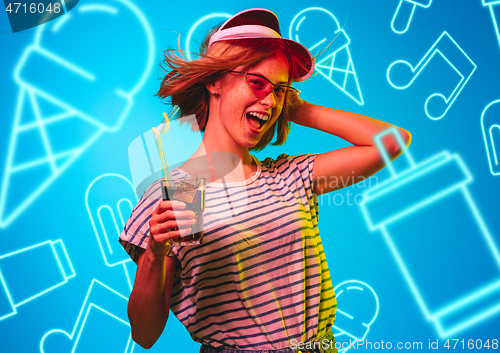 Image of Beautiful girl isolated on studio background in neon light