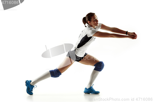 Image of Young female volleyball player isolated on white studio background