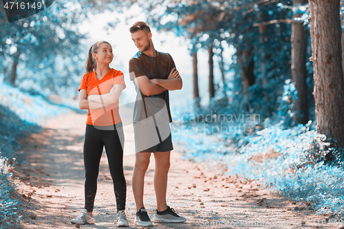 Image of young couple preparing for a morning run