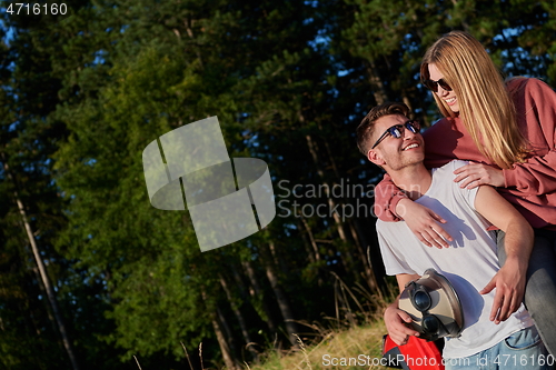 Image of couple enjoying beautiful sunny day while driving a off road buggy