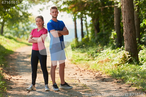 Image of young couple preparing for a morning run