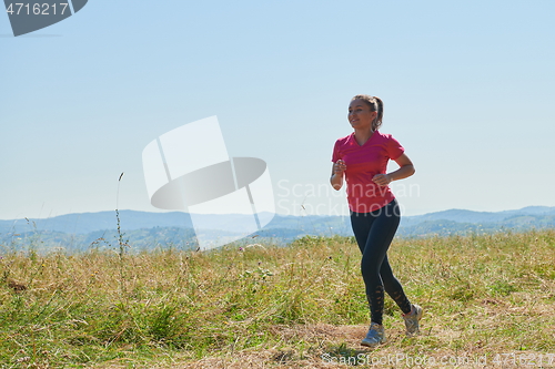 Image of woman enjoying in a healthy lifestyle while jogging