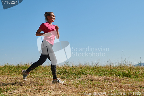 Image of woman enjoying in a healthy lifestyle while jogging