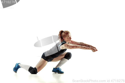 Image of Young female volleyball player isolated on white studio background