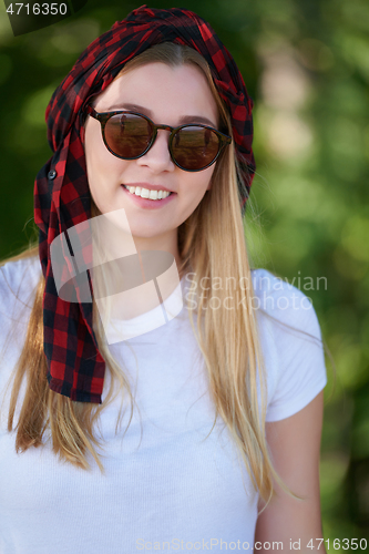 Image of portrait of beautiful, emotional, young woman in sunglasses.