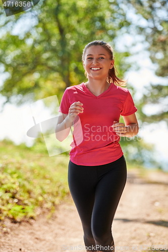 Image of woman enjoying in a healthy lifestyle while jogging