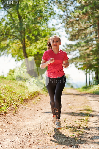 Image of woman enjoying in a healthy lifestyle while jogging