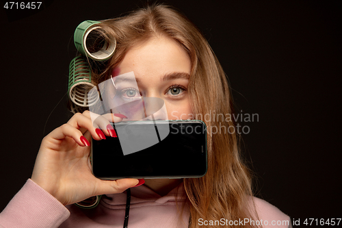 Image of Lie and another life in social media. Girl wearing make up on her face to hide bruises. Playing, pretending happy life.