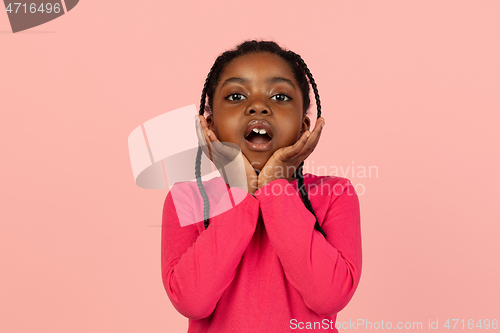 Image of Handsome african little girl portrait isolated on pink studio background with copyspace