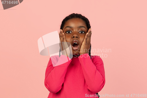 Image of Handsome african little girl portrait isolated on pink studio background with copyspace