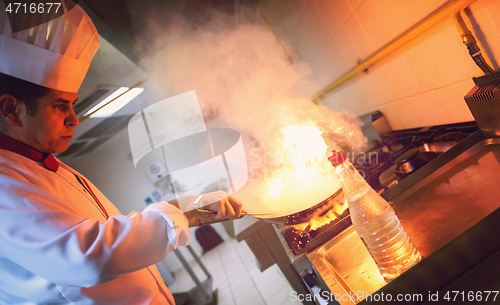 Image of Chef doing flambe on food