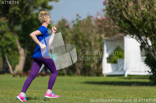 Image of young female runner training for marathon