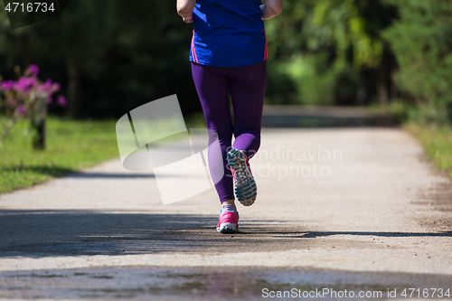 Image of young female runner training for marathon