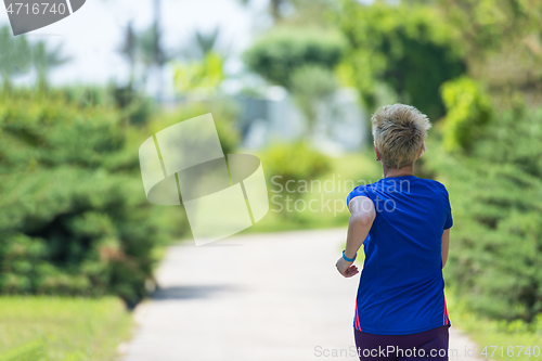 Image of young female runner training for marathon