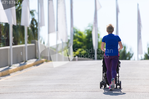 Image of mom with baby stroller jogging